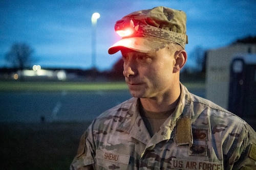 An Airman with a headlamp on his hat.