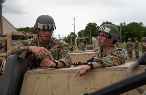 Two Airmen talking.