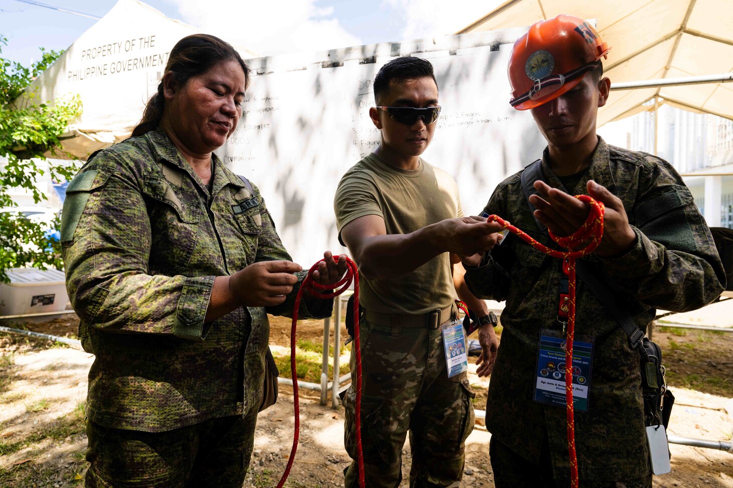 Virac, Philippines (June 3, 2025) – Hawaii National Guard Spc. Elvis Salinas and personnel from the Armed Forces of the Philippines Disaster Response Unit instruct local emergency responders and civilian authorities on knot-tying techniques used in rappelling during a training session in Virac, Philippines, June 3, 2025. This effort is part of a two-week urban rescue training exercise supporting the humanitarian assistance and disaster response objectives of Pacific Partnership 2025. Now in its 21st iteration, Pacific Partnership series is the largest annual multinational humanitarian assistance and disaster management preparedness mission conducted in the Indo-Pacific. Pacific Partnership works collaboratively with host and partner nations to enhance regional interoperability and disaster response capabilities, increase security and stability in the region, and foster new and enduring friendships in the Indo-Pacific. (U.S. Navy photo by Mass Communication Specialist 2nd Class Jordan Jennings)