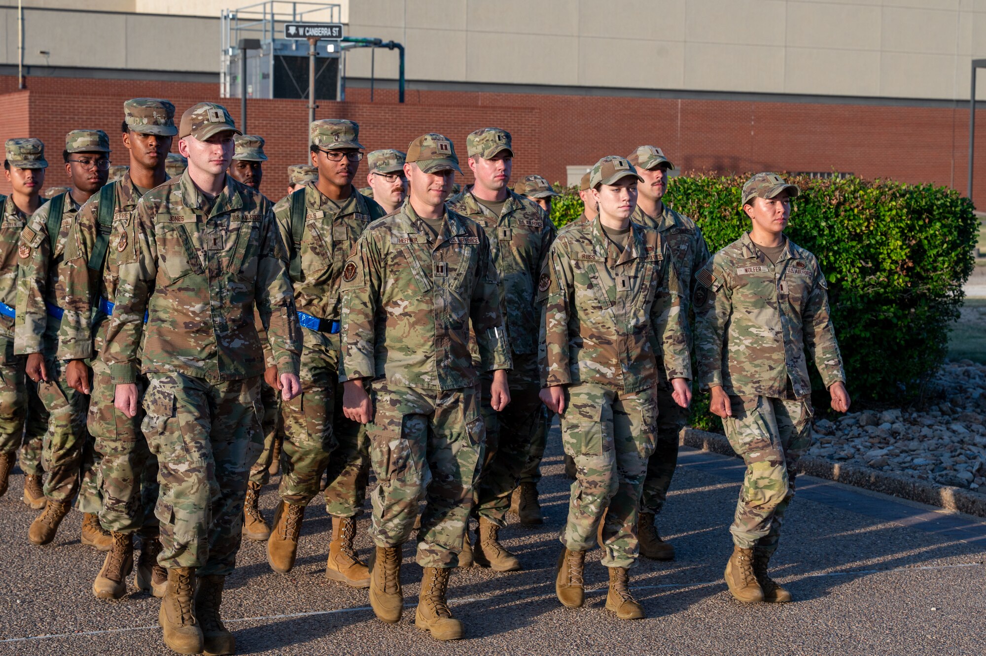 Members of the 315th Training Squadron march towards their campus as part of a mock deployment and bag-drag exercise held at Goodfellow Air Force Base, Texas, June 25th. During the event, officers led their enlisted wingmen through a mock-deployment sequence, consisting of a march across their campus and a detailed inspection. (U.S. Air Force photo by Airman 1st Class James Salellas)