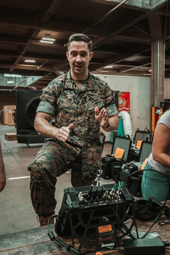 Chief Warrant Officer 3 Kevin Smidt, Handheld Radio Test Set (HHRTS) project officer with Marine Corps Systems Command, demonstrates system functionality during hands-on training and fielding with II Marine Expeditionary Force at Marine Corps Base Camp Lejeune, N.C., on May 21, 2025.