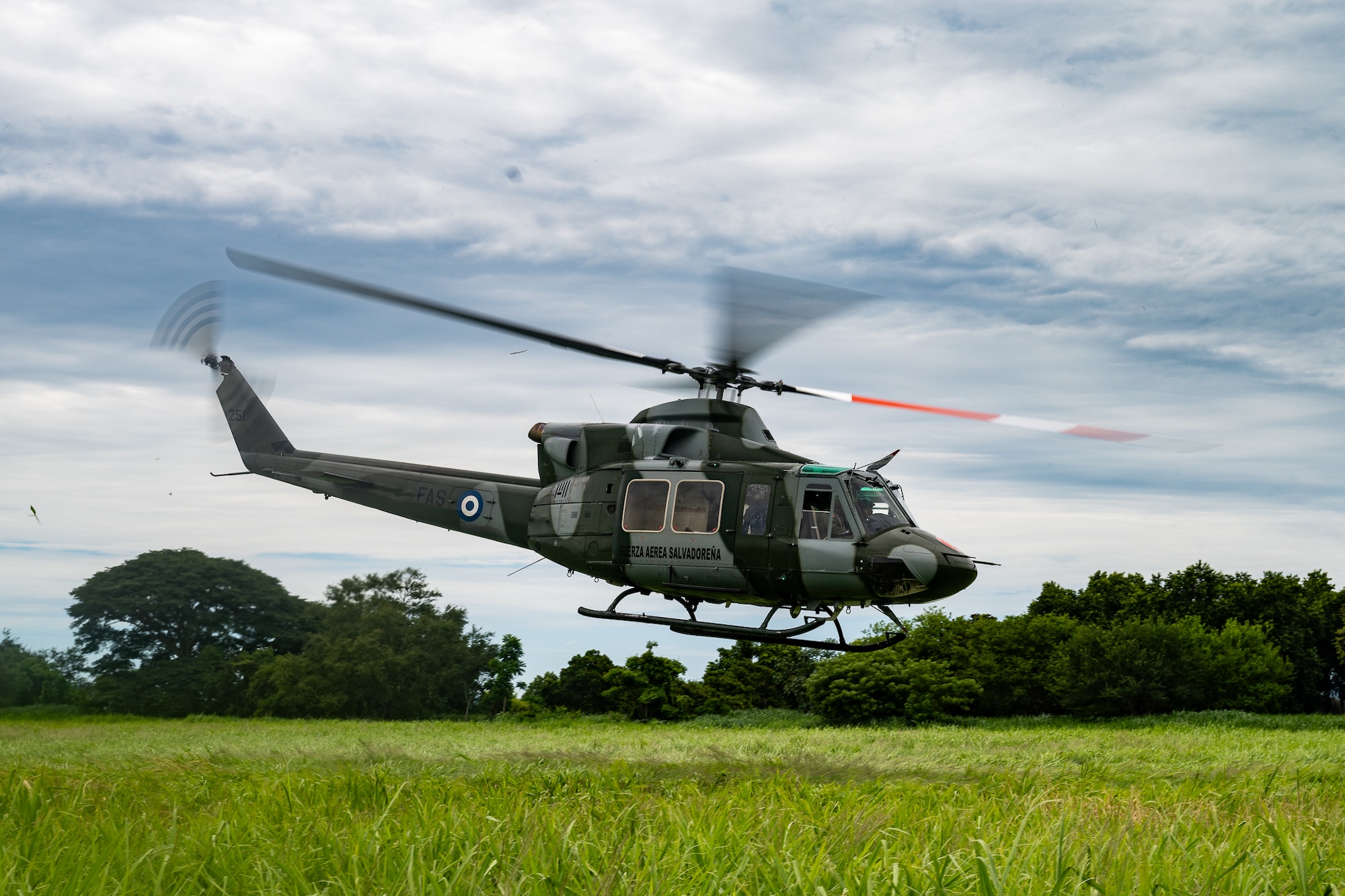 A Salvadoran Bell 412 helicopter takes off en route to the Central Military Hospital with a simulated patient on board during a training exercise in Ilopango, El Salvador, June 20, 2025. Salvadoran ground medical teams worked together to load the patient onto the aircraft as part of the AMISTAD campaign, a mission promoting cooperation between healthcare professionals of the U.S. and partner nations. (U.S. Air Force photo by Tech. Sgt. Justin Norton)