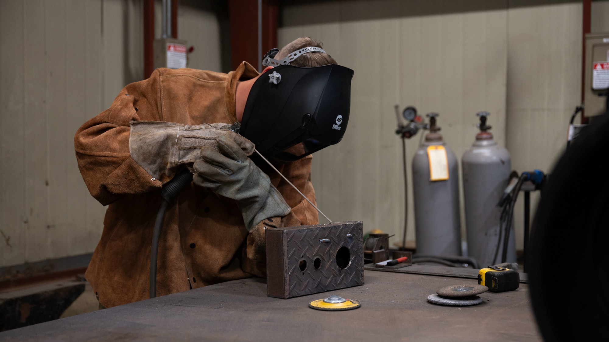 U.S. Air Force Staff Sgt. Matthew Hensel, 51st Civil Engineer Squadron non-commissioned officer in charge of metals, prepares metal work at Osan Air Base, Republic of Korea, June 25, 2025. Hensel came to Osan as a structural craftsman but quickly became NCOIC of metals because of his work ethic. (U.S. Air Force photo by Senior Airman Rome Bowermaster)