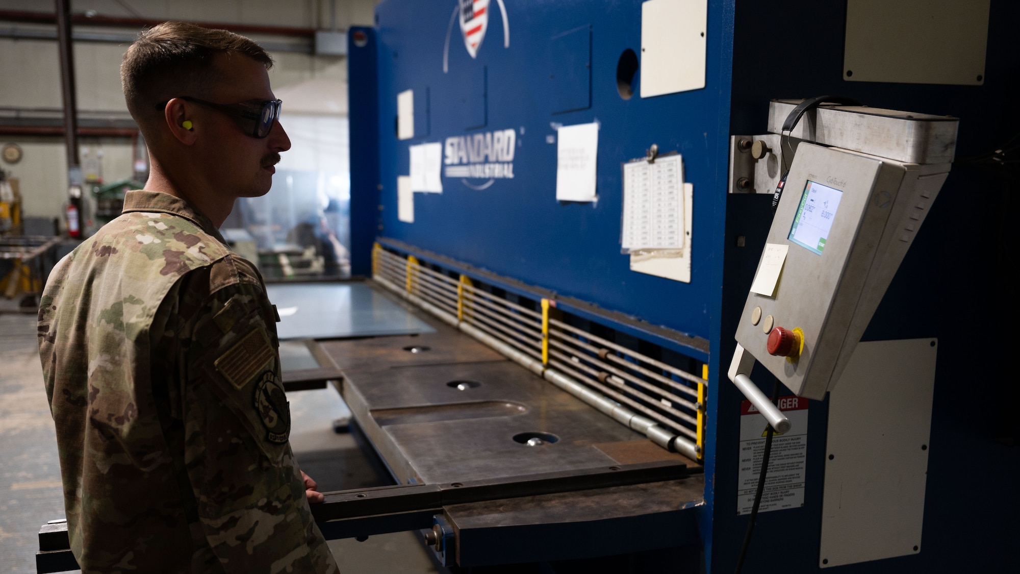U.S. Air Force Staff Sgt. Matthew Hensel, 51st Civil Engineer Squadron non-commissioned officer in charge of metals, operates a hydraulic shear at Osan Air Base, Republic of Korea, June 25, 2025. Hensel was recognized as Mustang of the Week for his outstanding performance as NCOIC of metals where he led teams of Airmen on multiple projects on base. (U.S. Air Force photo by Senior Airman Rome Bowermaster)