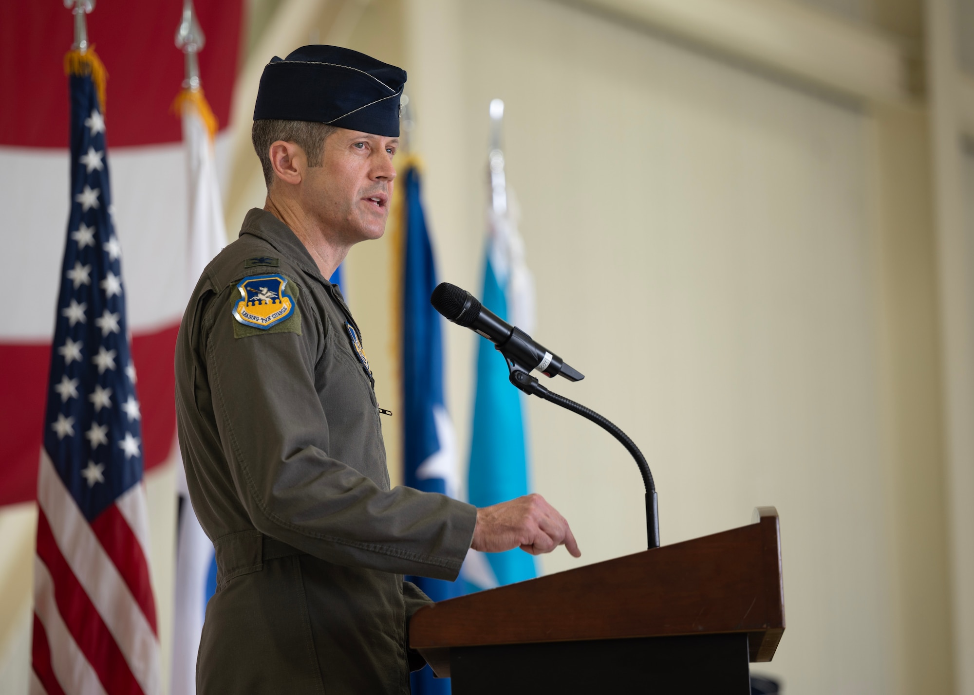 U.S. Air Force Col. William McKibban, outgoing 51st Fighter Wing commander, delivers farewell remarks during a Change of Command ceremony at Osan Air Base, Republic of Korea, June 27, 2025. McKibban was entrusted with the operational readiness, training, morale, welfare, installation support, and quality of life of more than 5,500 active duty personnel assigned to the 51st FW, Headquarters Seventh Air Force, and other U.S. Air Force, Army, Navy and Marine Corps units. (U.S. Air Force photo by Staff Sgt. Sarah Williams)