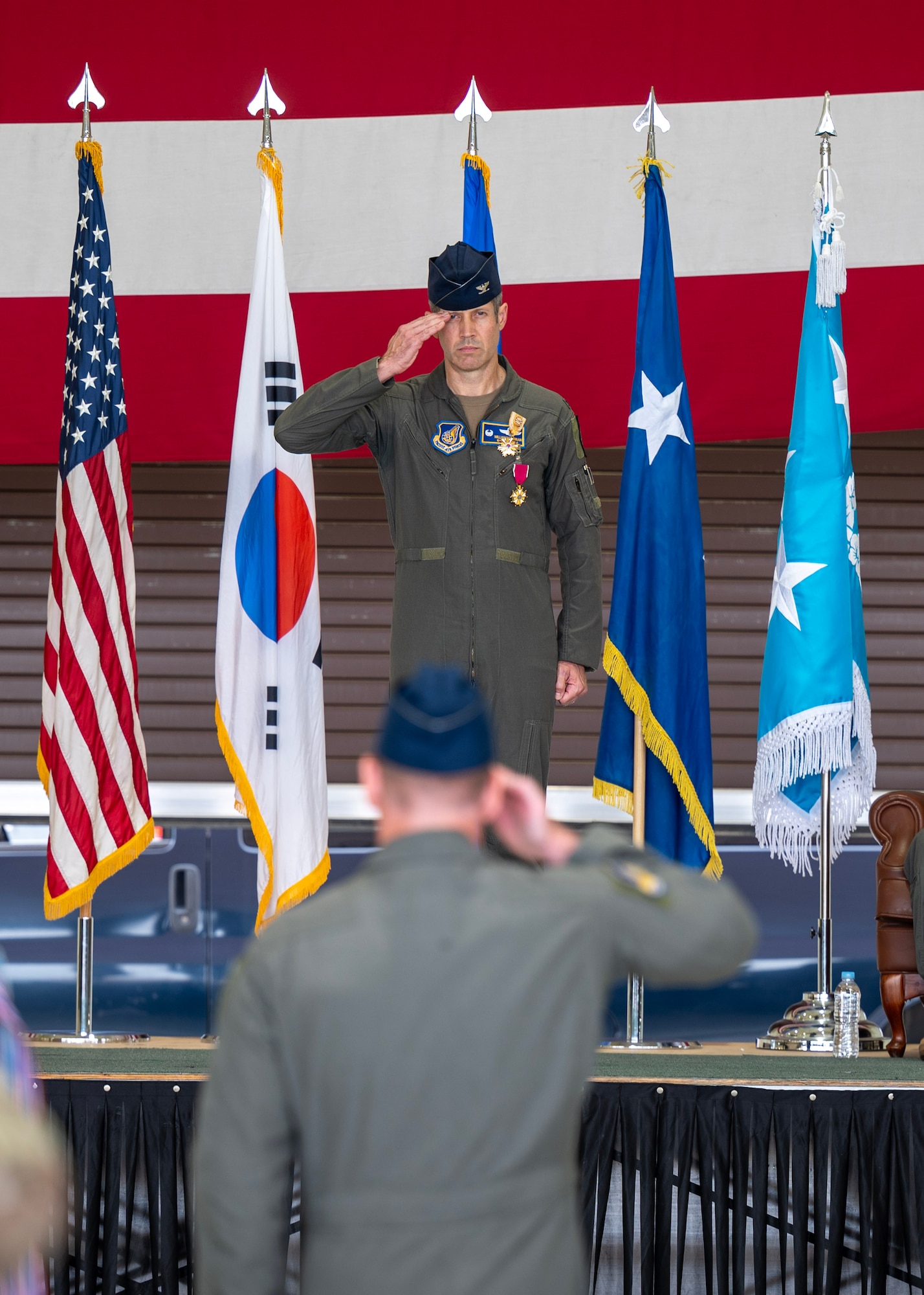 U.S. Air Force Col. William McKibban, outgoing 51st Fighter Wing commander, renders his final salute during a Change of Command ceremony at Osan Air Base, Republic of Korea, June 27, 2025. McKibban will go on to serve as the Pacific Air Forces commander executive officer at Joint Base Pearl Harbor-Hickam, Hawaii. (U.S. Air Force photo by Staff Sgt. Sarah Williams)