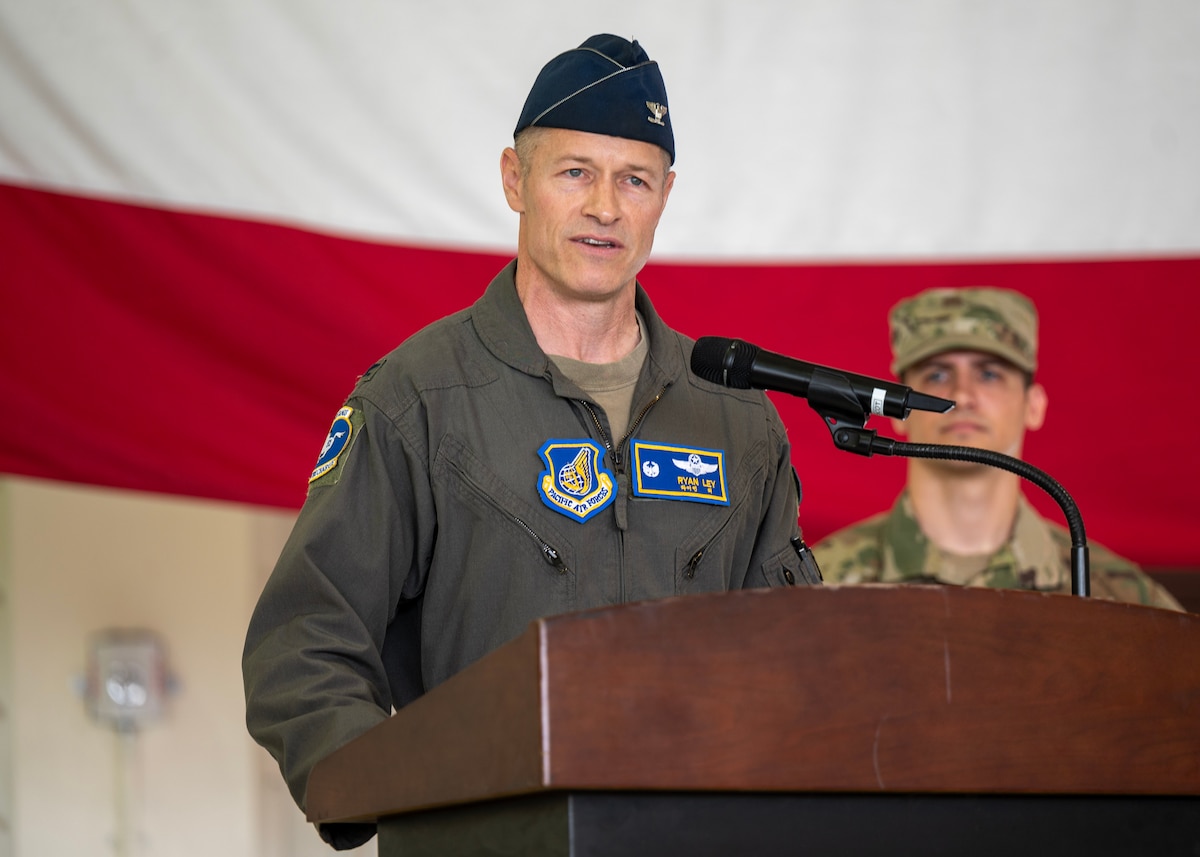 U.S. Air Force Col. Ryan Ley, incoming 51st Fighter Wing commander, delivers his first remarks to the squadron during a Change of Command ceremony at Osan Air Base, Republic of Korea, June 27, 2025. Prior to assuming command, Ley was previously responsible for over 5,000 military and civilian personnel supporting F-16 operations and managing $6 billion in assets. (U.S. Air Force photo by Staff Sgt. Sarah Williams)
