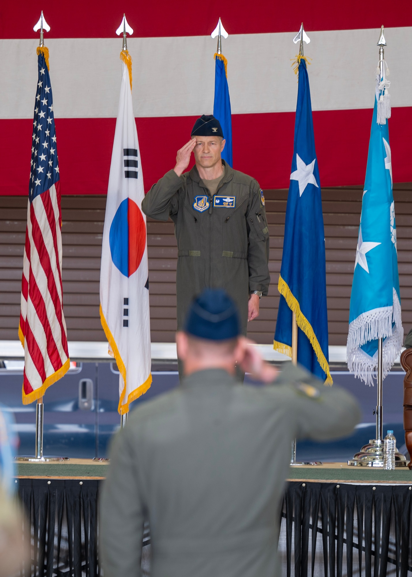 U.S. Air Force Col. Ryan Ley, incoming 51st Fighter Wing commander, renders his first salute during a Change of Command ceremony at Osan Air Base, Republic of Korea, June 27, 2025. Ley will lead the Air Force’s most forward-deployed permanently based wing while providing mission ready Airmen to execute combat operations and receive follow-on forces. (U.S. Air Force photo by Staff Sgt. Sarah Williams)