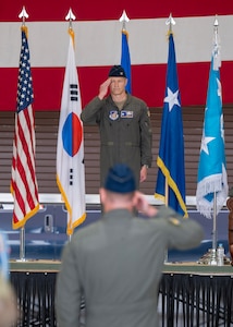 U.S. Air Force Col. Ryan Ley, incoming 51st Fighter Wing commander, renders his first salute during a Change of Command ceremony at Osan Air Base, Republic of Korea, June 27, 2025. Ley will lead the Air Force’s most forward-deployed permanently based wing while providing mission ready Airmen to execute combat operations and receive follow-on forces. (U.S. Air Force photo by Staff Sgt. Sarah Williams)