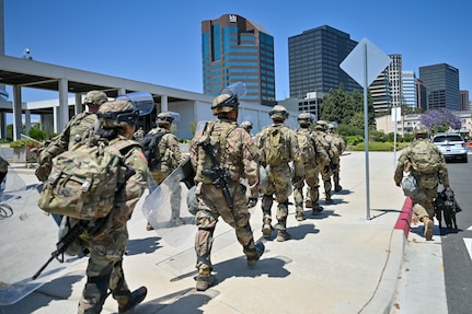 U.S. Army Soldiers with Alpha Company, 1st Battalion, 184th Infantry Regiment, California Army National Guard, arrive at the Wilshire Federal Building in Los Angeles, June 22, 2025.