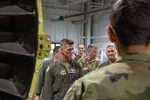 Maj. Gen. Michael Drowley arrives at a maintenance management shop.