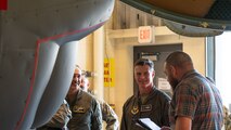 Airmen listen to a B-52H Stratofortress briefing.