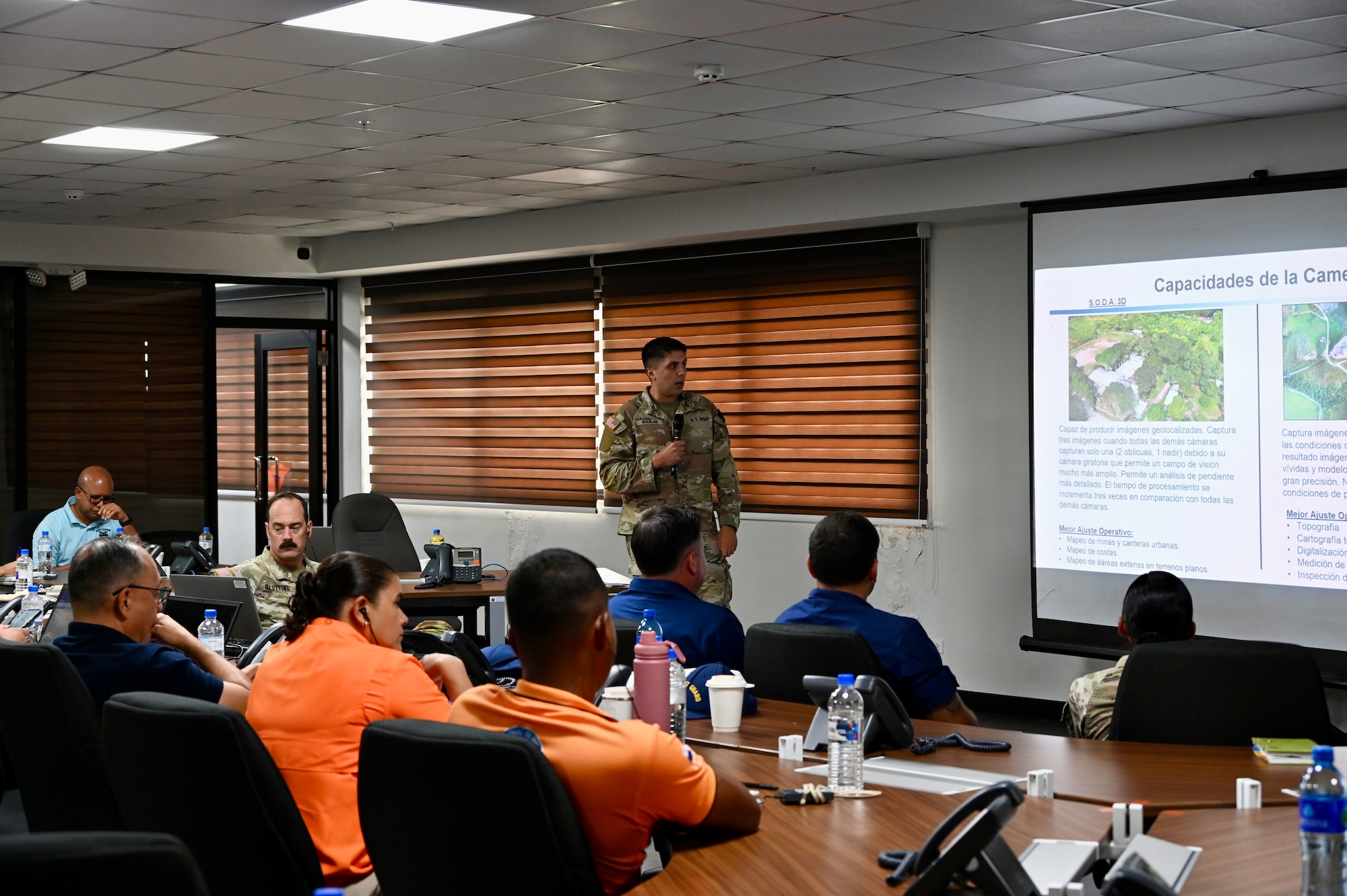 A military member from JTF-Bravo delivers a capability briefing to emergency responders from Panama