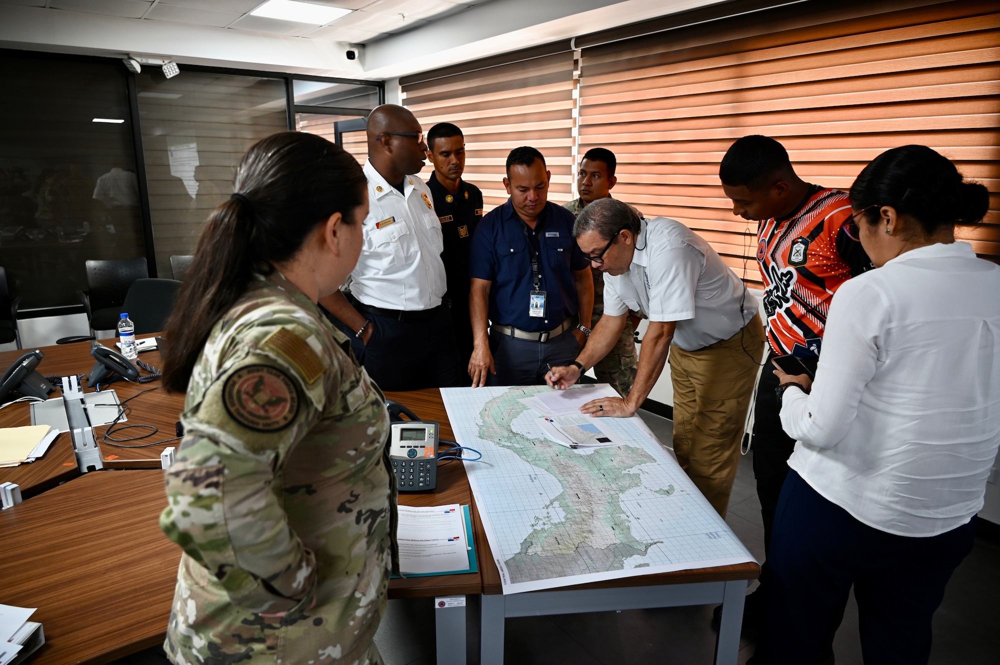 Exercise personnel view a map to determine areas affected during the exercise scenario.