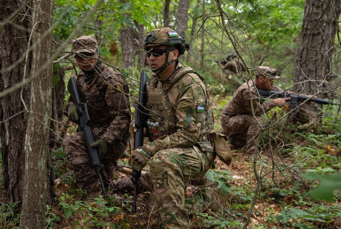 Soldiers from multiple nations pulling security at the culminating event during exercise Regional Cooperation 25 at Camp Edwards, Massachusetts June 26th, 2025. Regional Cooperation 25 is an annual, multinational U.S. Central Command-sponsored command-post and field training exercise conducted by National Guard units in partnership with Central and South Asian nations. (U.S. Army National Guard photo by Sgt. James Vaughan)