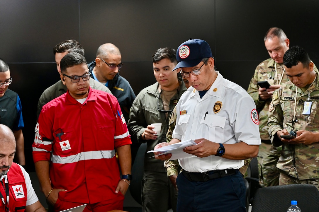 emergency management person from Panama leads a group discussion in exercise scenario planning