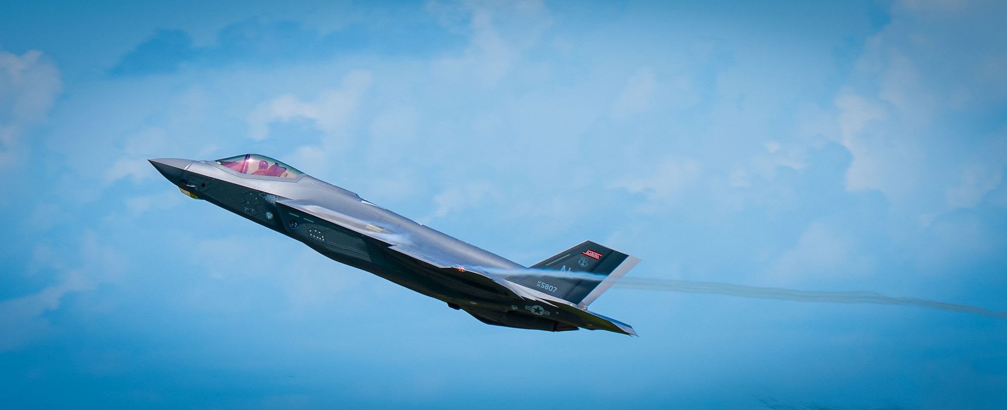 A U.S. Air Force F-35A Lightning II from the 187th Fighter Wing flies at low-level during a comprehensive noise exercise at Moody Air Force Base, Georgia, June 18, 2025. The assessment examined the effectiveness of pilot techniques, such as optimized flight paths, in minimizing noise exposure. (U.S. Air Force photo by 1st Lt. Benjamin Williams)