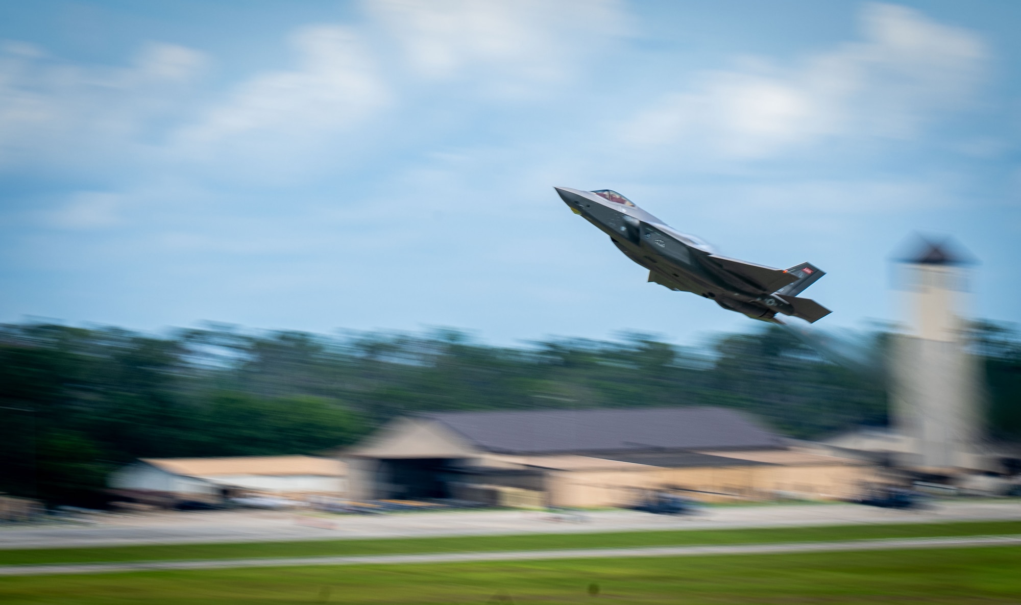 A U.S. Air Force F-35A Lightning II from the 187th Fighter Wing flies at low-level during a comprehensive noise exercise at Moody Air Force Base, Georgia, June 18, 2025. The data captured during the exercise will be compared to existing noise models to validate their accuracy and predictive capabilities. (U.S. Air Force photo by 1st Lt. Benjamin Williams)