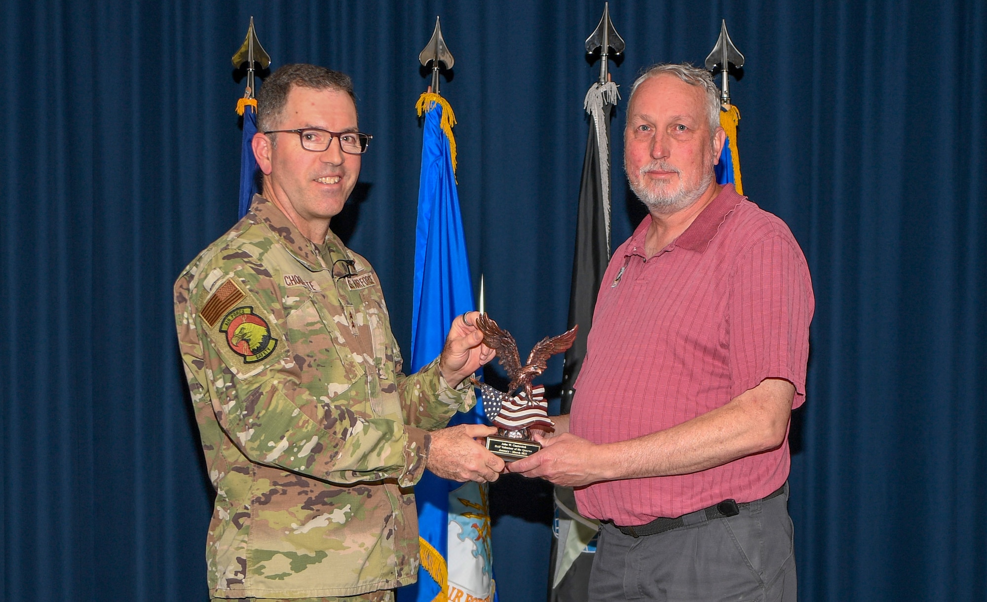 Mr. Jay Guetersloh receives the HAF Volunteer of the Quarter award from Maj. Gen. Sean Choquette