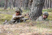 A Danish Armed Forces soldier directs the squad assault during Exercise Baltic Viking at Camp Ādaži, Latvia, June 6, 2025. A squad from the Danish Armed Forces joined Michigan Army National Guard soldiers in a squad live-fire exercise. U.S. military conducts multinational training and exercises across Europe to increase lethality and strengthen partnerships with NATO allies and regional security partners.  By doing so, the U.S. provides combat-credible forces to V Corps, the U.S. Army’s only forward-deployed corps in Europe. (U.S. Army photo by Staff Sgt. Joseph Novak)