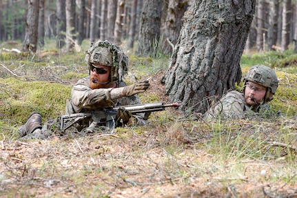 A Danish Armed Forces soldier directs the squad assault during Exercise Baltic Viking at Camp Ādaži, Latvia, June 6, 2025. A squad from the Danish Armed Forces joined Michigan Army National Guard soldiers in a squad live-fire exercise. U.S. military conducts multinational training and exercises across Europe to increase lethality and strengthen partnerships with NATO allies and regional security partners.  By doing so, the U.S. provides combat-credible forces to V Corps, the U.S. Army’s only forward-deployed corps in Europe. (U.S. Army photo by Staff Sgt. Joseph Novak)