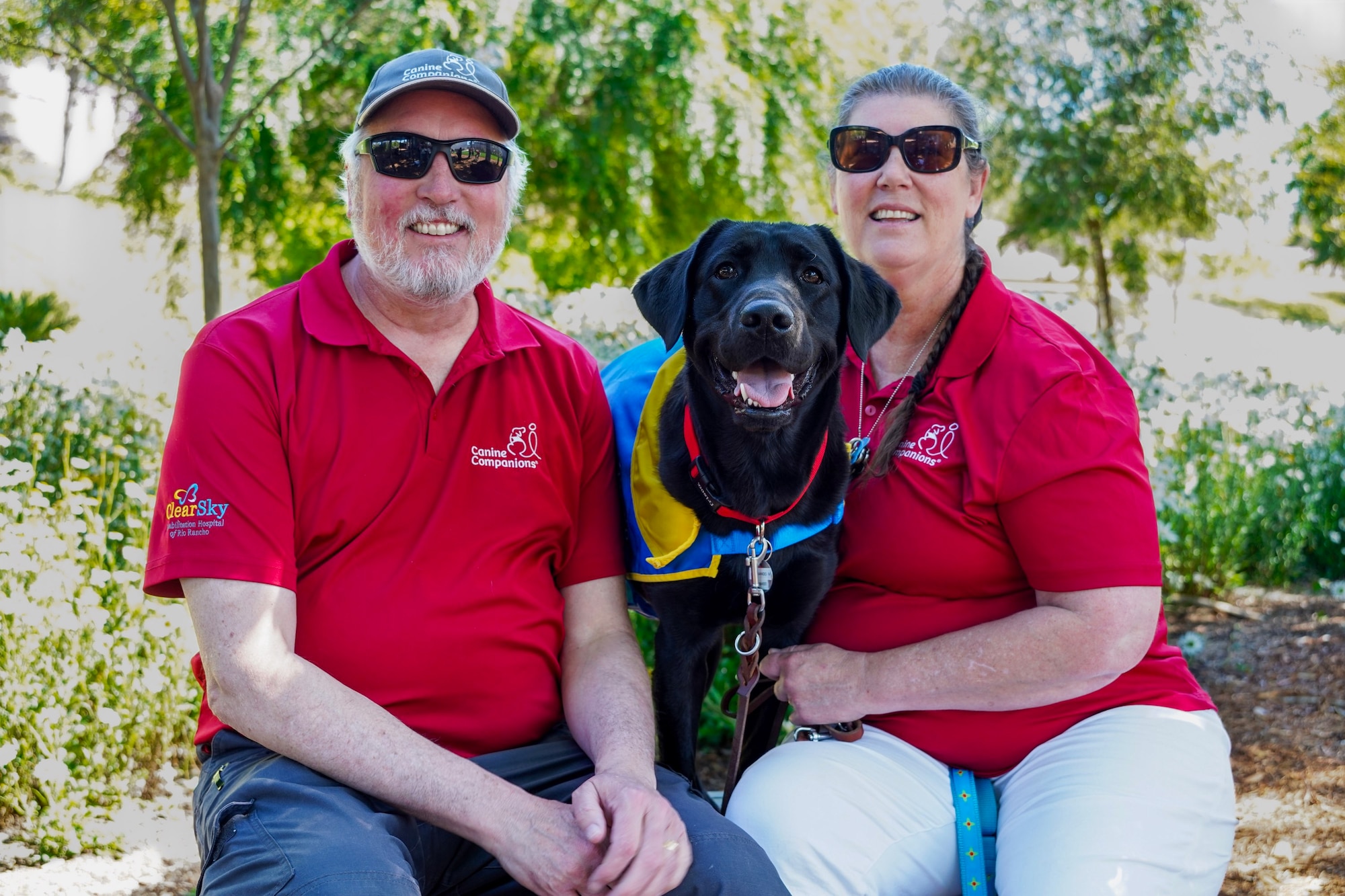 Jay Guetersloh and his wife Betsy with their service dog in training Fernando.