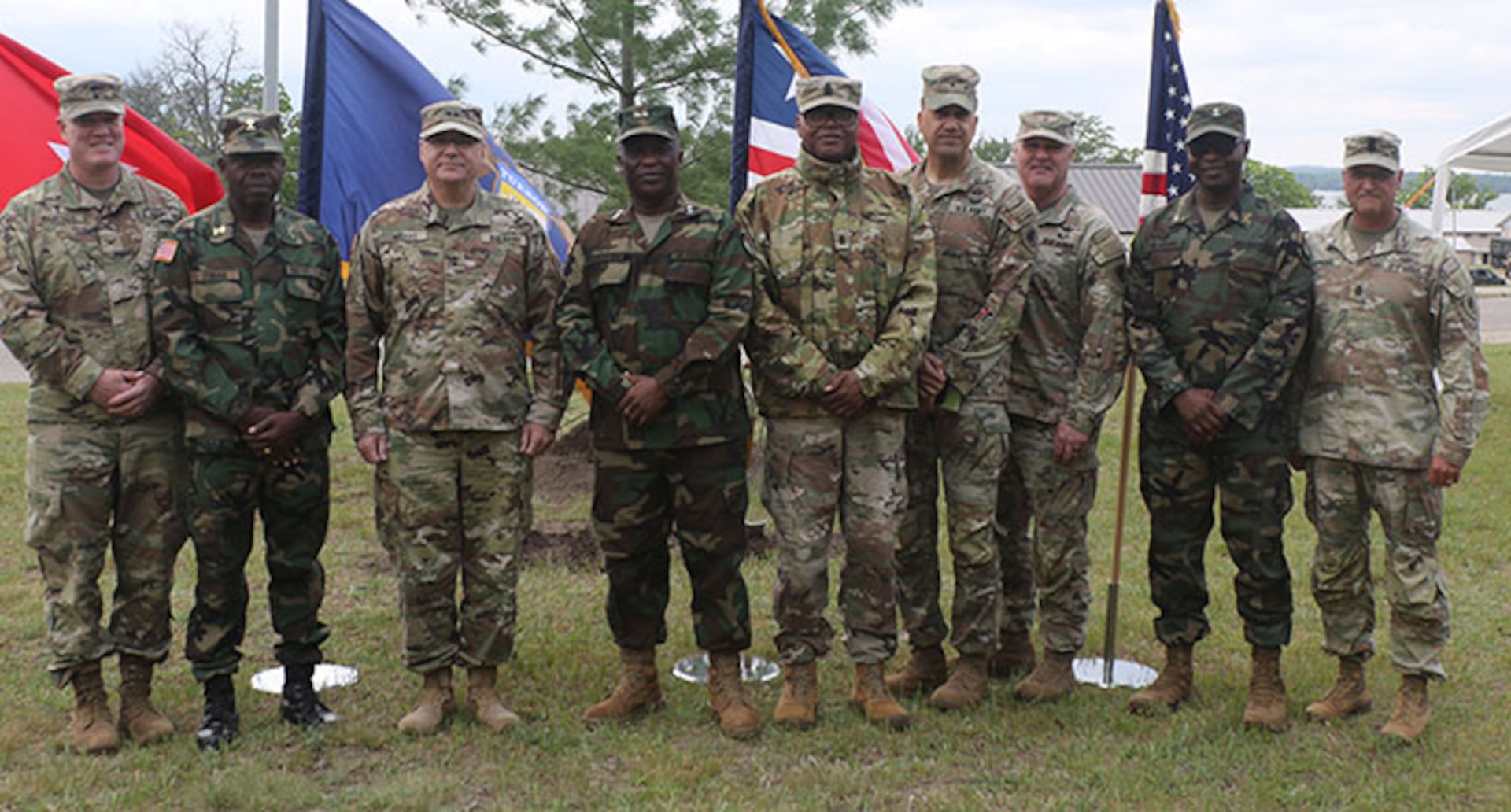 Michigan Army National Guard, stand for a photo in front of a white pine – Michigan’s state tree – dedicated near the Camp Grayling chapel to symbolize the strength of the Michigan-Liberia partnership