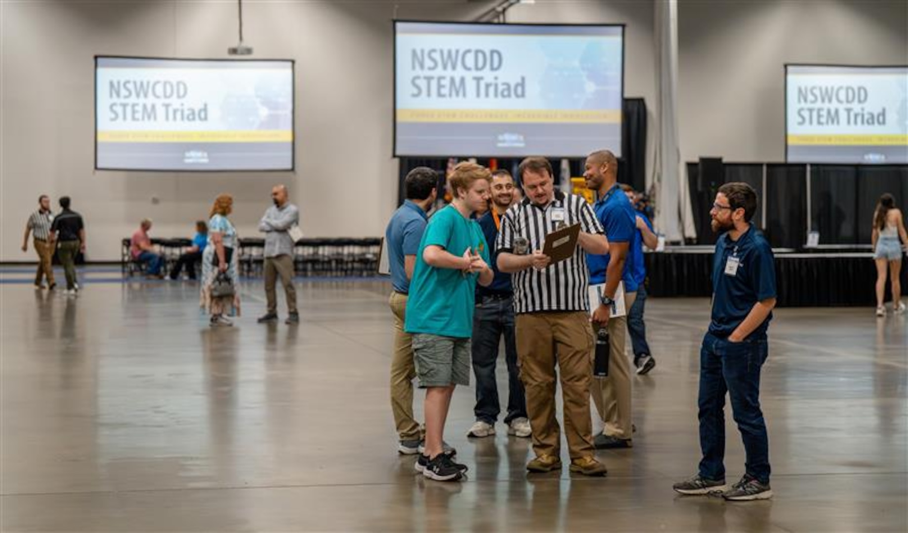 FREDERICKSBURG, Va. – The inaugural STEM Triad event, held by the Naval Surface Warfare Center Dahlgren Division (NSWCDD) at the Fredericksburg Convention Center in Virginia provided an excellent opportunity for middle and high school students to dive into the world of STEM. NSWCDD subject matter experts and STEM mentors were available to support both students and educators throughout the competition. Their goal was not only to help participants excel in the three challenges but also to inspire them to become the future leaders in STEM fields. (Dorina Watermolen/NSWCDD photo)