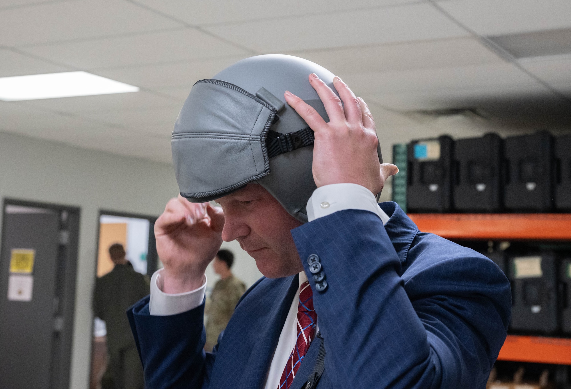 Ryan Ackerman, 91st Missile Wing (91MW) honorary commander, tries on a helmet for an orientation flight at Minot Air Force Base, North Dakota, June 24, 2025. As a Task Force 21 civic leader and 91MW honorary commander, Ackerman helps advocate for the Airman, families, and mission on base. (U.S. Air Force photo by Airman 1st Class Wesley Davies)
