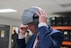 Ryan Ackerman, 91st Missile Wing (91MW) honorary commander, tries on a helmet for an orientation flight at Minot Air Force Base, North Dakota, June 24, 2025. As a Task Force 21 civic leader and 91MW honorary commander, Ackerman helps advocate for the Airman, families, and mission on base. (U.S. Air Force photo by Airman 1st Class Wesley Davies)