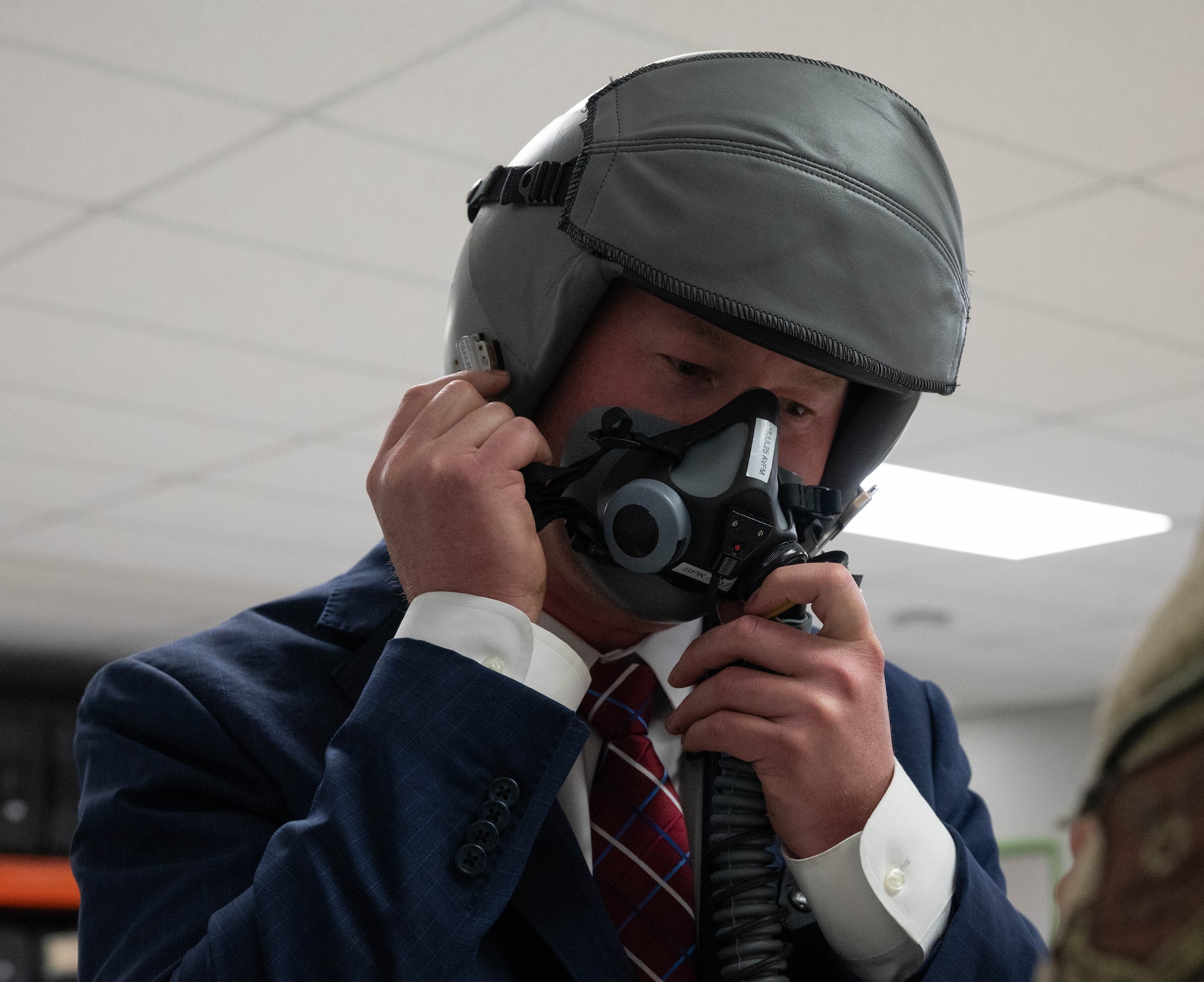 Ryan Ackerman, 91st Missile Wing honorary commander, tries on an oxygen mask for an orientation flight at Minot Air Force Base, North Dakota, June 24, 2025. The Aircrew Flight Equipment flight maintains and provides life support and flight equipment to aircrew and civilians prior to a flight. (U.S. Air Force photo by Airman 1st Class Wesley Davies)