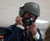 Ryan Ackerman, 91st Missile Wing honorary commander, tries on an oxygen mask for an orientation flight at Minot Air Force Base, North Dakota, June 24, 2025. The Aircrew Flight Equipment flight maintains and provides life support and flight equipment to aircrew and civilians prior to a flight. (U.S. Air Force photo by Airman 1st Class Wesley Davies)