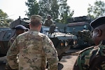U.S. Air Force Maj. Gen. Gary Keefe, the adjutant general of the Massachusetts National Guard (MANG), observes the progress of the ongoing M1117 Armored Support Vehicle refurbishment initiative at the Kahawa Barracks in Nairobi, Kenya, May 30, 2025. This collaborative initiative between MANG and the Kenya Defence Forces underscores a decade of collaboration through the State Partnership Program.