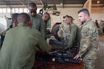 U.S. Army Staff. Sgt. Evan Boyer, an electronics and small arms repairer with the Massachusetts National Guard, works with members of the Kenya Army Corps of Electrical and Mechanical Engineering at the Kahawa Barracks in Nairobi, Kenya, on May 30, 2025.