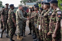 U.S. Air Force Maj. Gen. Gary Keefe, the adjutant general of the Massachusetts National Guard, shakes hands with members of the Kenya Defence Forces (KDF) at the Kahawa Barracks in Nairobi, Kenya, May 30, 2025.
