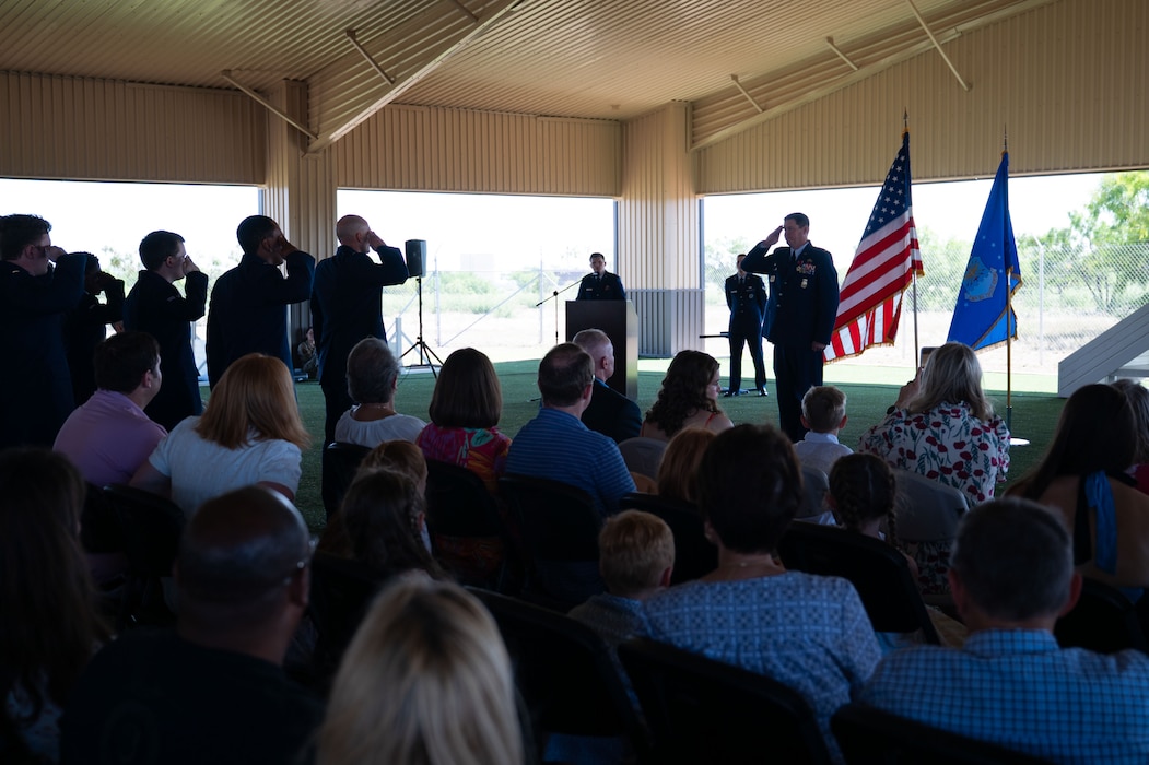 U.S. Air Force Airmen assigned to the 17th Mission Support Group present Col. Timothy Dalby, outgoing 17th Mission Support Group commander, with his final salute upon relinquishing command at the 17th Security Forces Squadron kennels, Goodfellow Air Force Base, Texas, June 26, 2025. The 17th MSG is composed of six squadrons responsible for all aspects of logistical and personnel support on Goodfellow. (U.S. Air Force Photo by Airman 1st Class Brian Lummus)