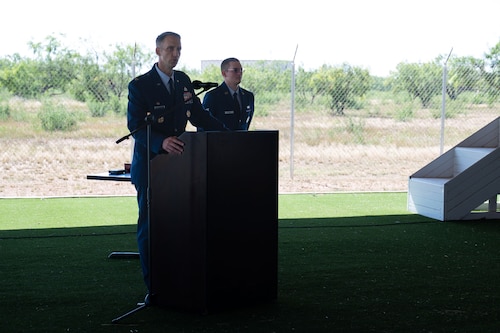 U.S. Air Force Col. Nathan Olsen, 17th Mission Support Group commander, speaks during the change of command ceremony at the 17th Security Forces Squadron kennels, Goodfellow Air Force Base, Texas, June 26, 2025. The 17th MSG is a diverse group responsible for delivering security, communications, logistics, civil engineering, contracting, and community support programs to Goodfellow’s military and civilian personnel. (U.S. Air Force Photo by Airman 1st Class Brian Lummus)
