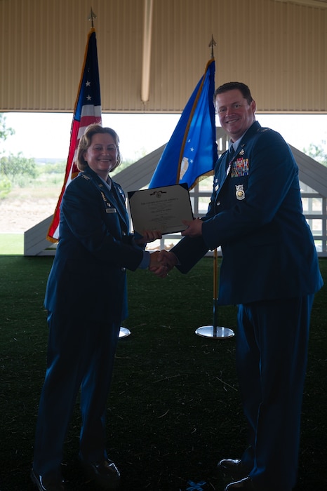 U.S. Air Force Col. Timothy Dalby, outgoing 17th Mission Support Group commander,
receives the Legion of Merit during the change of command ceremony at the 17th Security Forces Squadron kennels, Goodfellow Air Force Base, Texas, June 26, 2025. Dalby executed two community support agreements exchanging vehicle and fire truck repair for ambulance and school bus services, oversaw the execution of over $142.3 million dollars to bolster quality of life and services, guided Air Education and Training Command’s second largest classified network into becoming the best in AETC and partnered with the city and county to garner over $8 million dollars in Texas State grants for the base’s infrastructure. (U.S. Air Force photo by Airman 1st Class Brian Lummus)