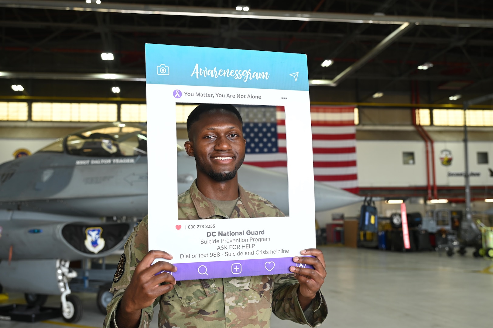 A member of the 113th Wing, District of Columbia Air National Guard, takes an Awarenessgram at Joint Base Andrews, Md., on June 8, 2025. The District of Columbia National Guard’s Risk Reduction program has introduced suicide prevention selfies (Awarenessgram) as a tool to encourage those who may be unknowingly or knowingly facing mental health challenges to utilize the appropriate resources.