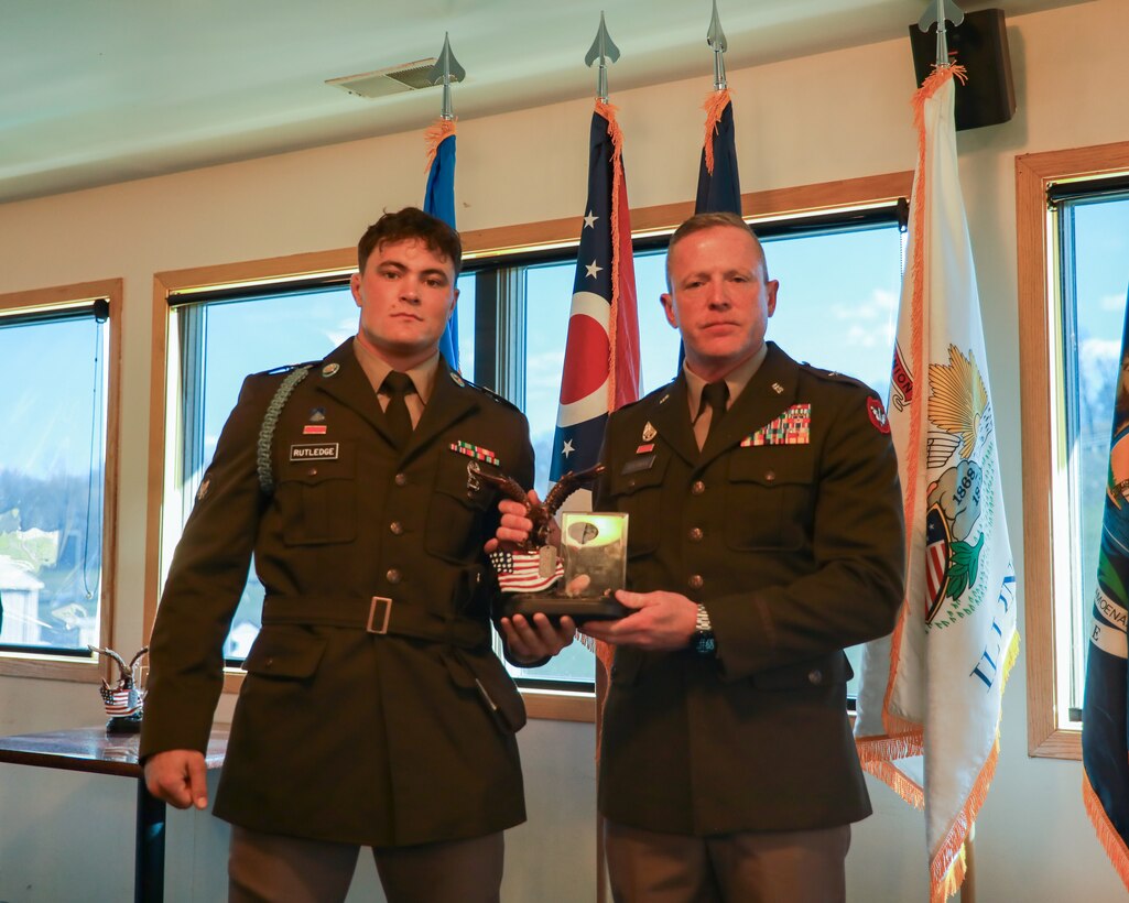 Michigan Army National Guard Spc. Logan J. Rutledge, an infantryman with Bravo Company, 1st Battalion, 125th Infantry Regiment, 37th Infantry Brigade Combat Team, 38th Infantry Division, is awarded Soldier of the Year by Brig. Gen. Brion J. Aderman, Wisconsin's deputy adjutant general for Army, during the closing ceremony of the National Guard Region IV Best Warrior Competition at Fort McCoy, Wis., May 3, 2025. The National Guard Region IV Best Warrior Competition is an annual event where the state best warriors from Illinois, Indiana, Iowa, Michigan, Minnesota, Ohio, and Wisconsin compete in various warrior skill challenges, with the selected winners advancing to the national competition. (U.S. Army National Guard photo by Spc. Jack Schave)