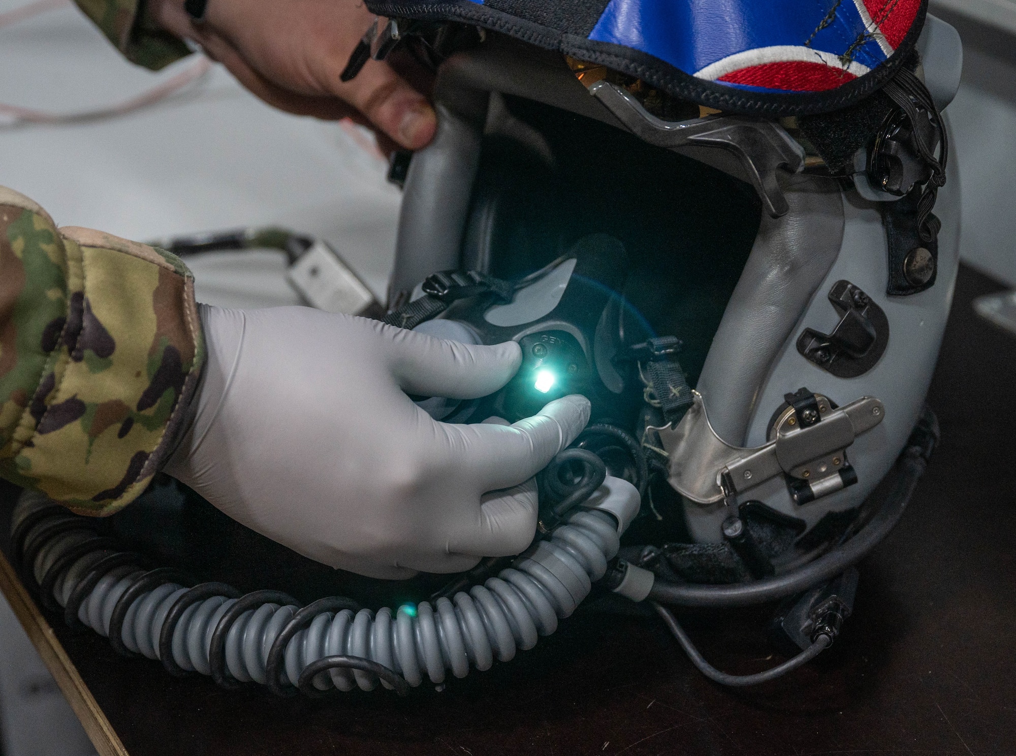 U.S. Air Force Senior Airman Lacy Toal, 495th Fighter Squadron lead aircrew flight equipment technician, cleans and inspects a pilot helmet during exercise Atlantic Trident 25 at Pirkkala Air Base, Finland, June 24, 2025. Aircrew flight equipment Airmen played a crucial role during AT 25, setting a precedent for readiness by conducting thorough inspections and repairs on pilot gear. (U.S. Air Force photo by Airman 1st Class Sierra Casteel)