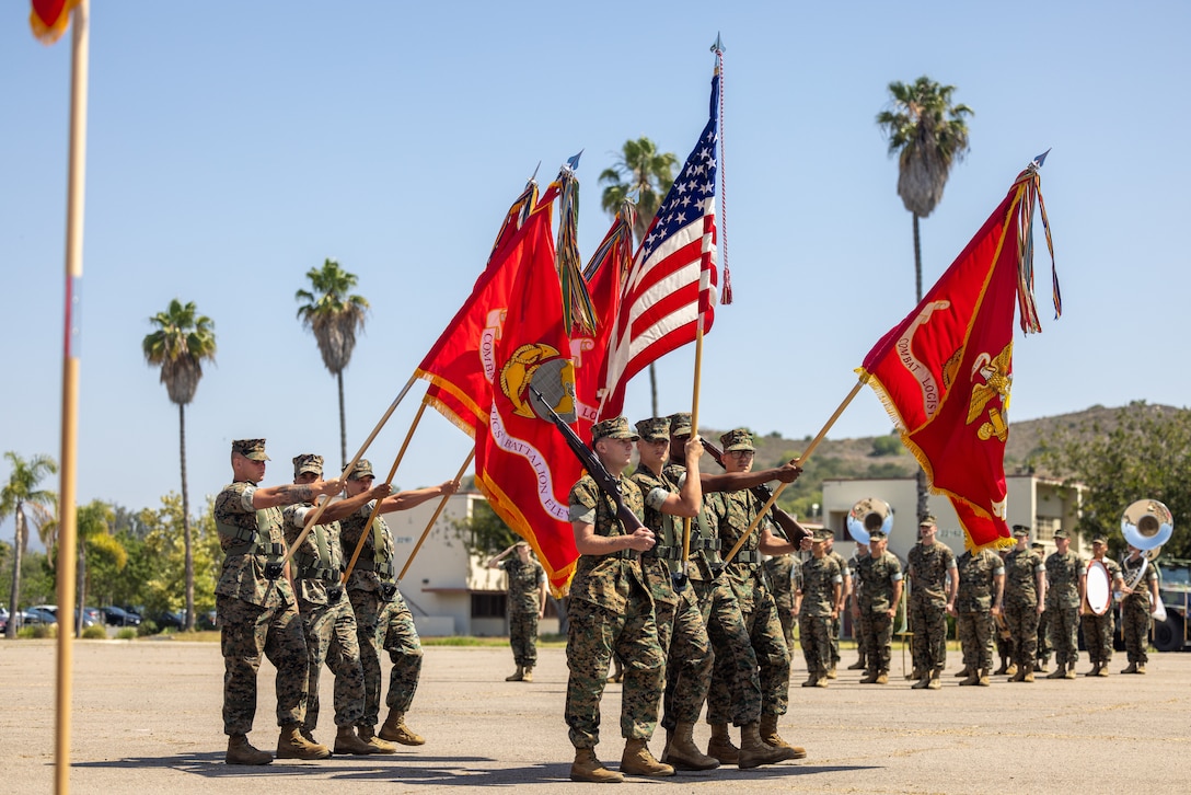 U.S. Marines with Combat Logistics Regiment 17, 1st Marine Logistics Group, conduct a pass in review during a change of command ceremony on Marine Corps Base Camp Pendleton, California, June 26, 2025. The change of command ceremony symbolizes the passing of authority and responsibility from the outgoing to the incoming commanding officer. CLR-17 is prepared to serve as the Logistics Combat Element headquarters for 1st MLG forward, where its mission is to be capable of general distribution, maneuver support, maintenance, supply, health services, general engineering, and Explosive Ordnance Disposal support. (U.S. Marine Corps photo by Lance Cpl. Deja Rogers)