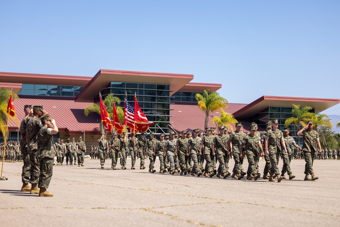 U.S. Marines with Combat Logistics Regiment 17, 1st Marine Logistics Group, conduct a pass in review during a change of command ceremony on Marine Corps Base Camp Pendleton, California, June 26, 2025. The change of command ceremony symbolizes the passing of authority and responsibility from the outgoing to the incoming commanding officer. CLR-17 is prepared to serve as the Logistics Combat Element headquarters for 1st MLG forward, where its mission is to be capable of general distribution, maneuver support, maintenance, supply, health services, general engineering, and Explosive Ordnance Disposal support. (U.S. Marine Corps photo by Lance Cpl. Deja Rogers)