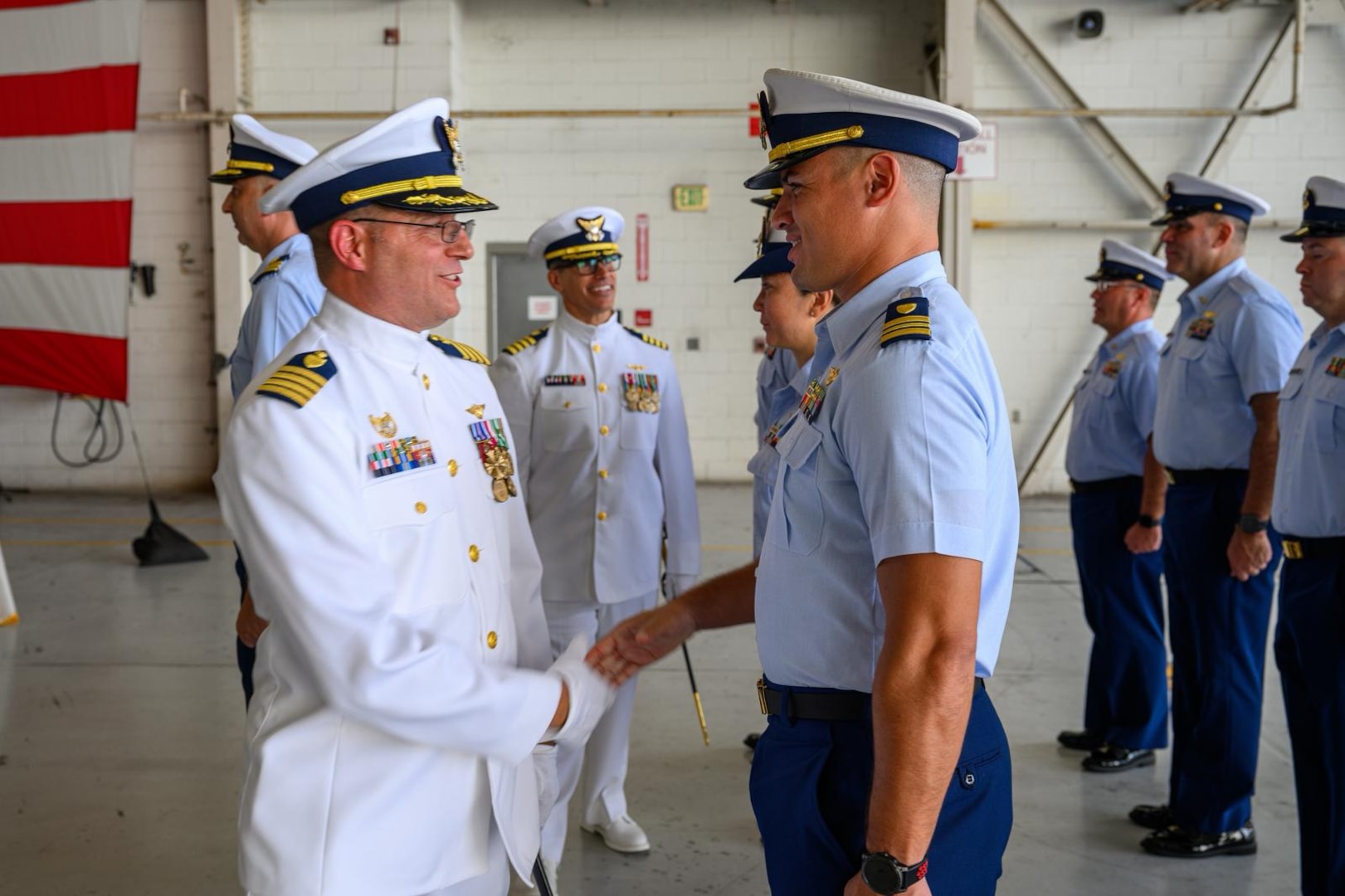 U.S. Coast Guard Capt. Eric Smith, Coast Guard Air Station Miami commander, conducts a review of his crew before a change of command at Air Station Miami, June 27, 2025. Smith was joined by Capt. Aaron Ortenzio, the incoming air station commander. (U.S. Coast Guard photo by Auxiliarist Joey Feldman)