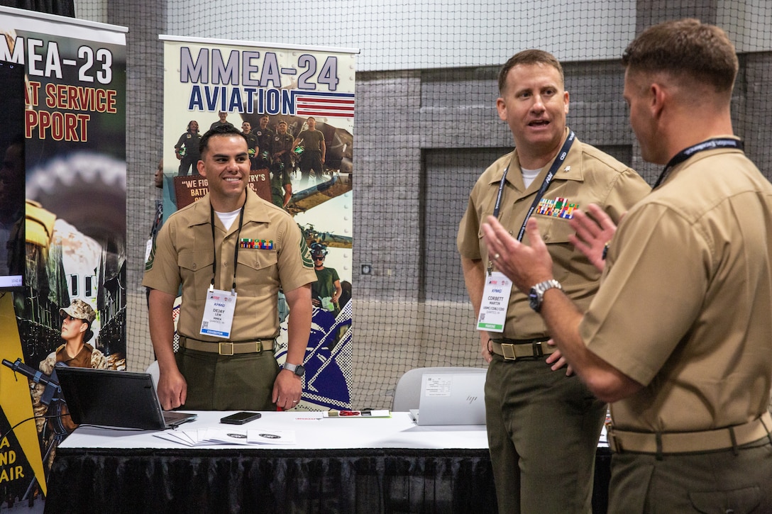 U.S. Marines with Manpower Management Enlisted Assignments (MMEA) discuss retention initiatives and opportunities with participants at the MMEA booth during Modern Day Marine (MDM) at the Walter E. Washington Convention Center, Washington, D.C., May 1, 2025. Manpower and Reserve Affairs showcased evolving personnel policies at MDM 2025, highlighting programs in talent management, retention, family readiness, and total force fitness. (U.S. Marine Corps photo by Cpl. Anthony C. Ramsey Jr.)