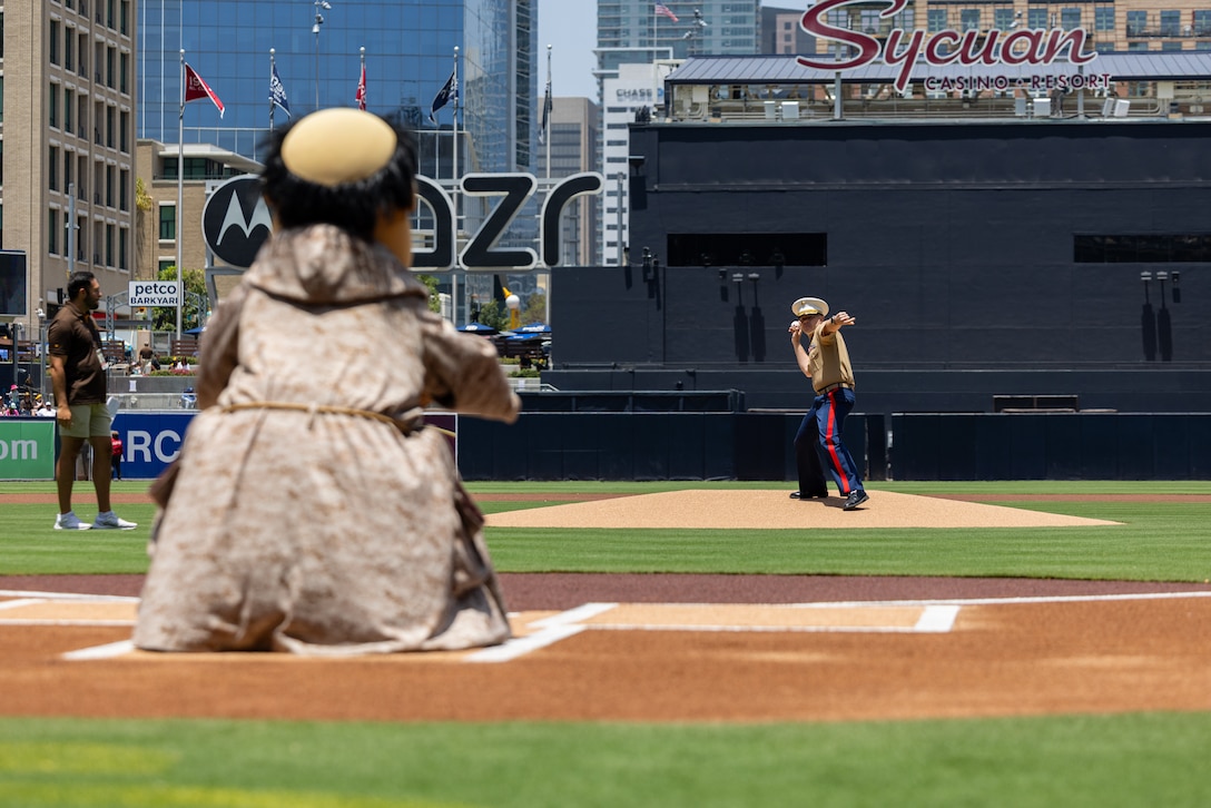 U.S. Marine Corps Lt. Col Michael L. Drozd, commanding officer of Marine Heavy Helicopter Squadron (HMH) 465, Marine Aircraft Group 16, 3rd Marine Aircraft Wing, throws the ceremonial first pitch at the San Diego Padres military appreciation pre-game ceremony at Petco Park in San Diego, June 22, 2025. The Padres host Military Salutes throughout the season to honor the service of military personnel, recognize their accomplishments, and celebrate key moments in military history. (U.S. Marine Corps photo by Lance Cpl. Jeslianne A. Torres)
