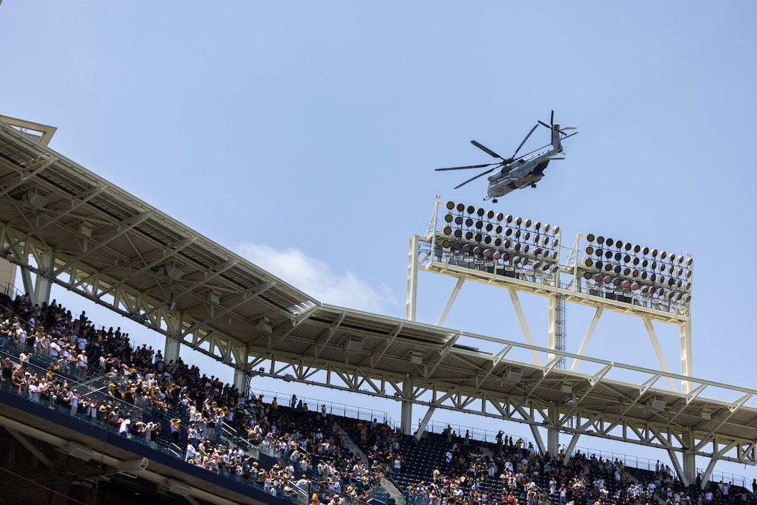 A U.S. Marine Corps CH-53E Super Stallion with Marine Heavy Helicopter Squadron (HMH) 465, Marine Aircraft Group 16, 3rd Marine Aircraft Wing, flies over Petco Park during a San Diego Padres military appreciation pre-game ceremony at Petco Park in San Diego, June 22, 2025. The Padres host Military Salutes throughout the season to honor the service of military personnel, recognize their accomplishments, and celebrate key moments in military history. (U.S. Marine Corps photo by Lance Cpl. Jeslianne A. Torres)