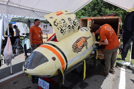 Students from Oregon State University work on their submarine, Castorea, at the 18th International Submarine Races held at NSWC Carderock Division