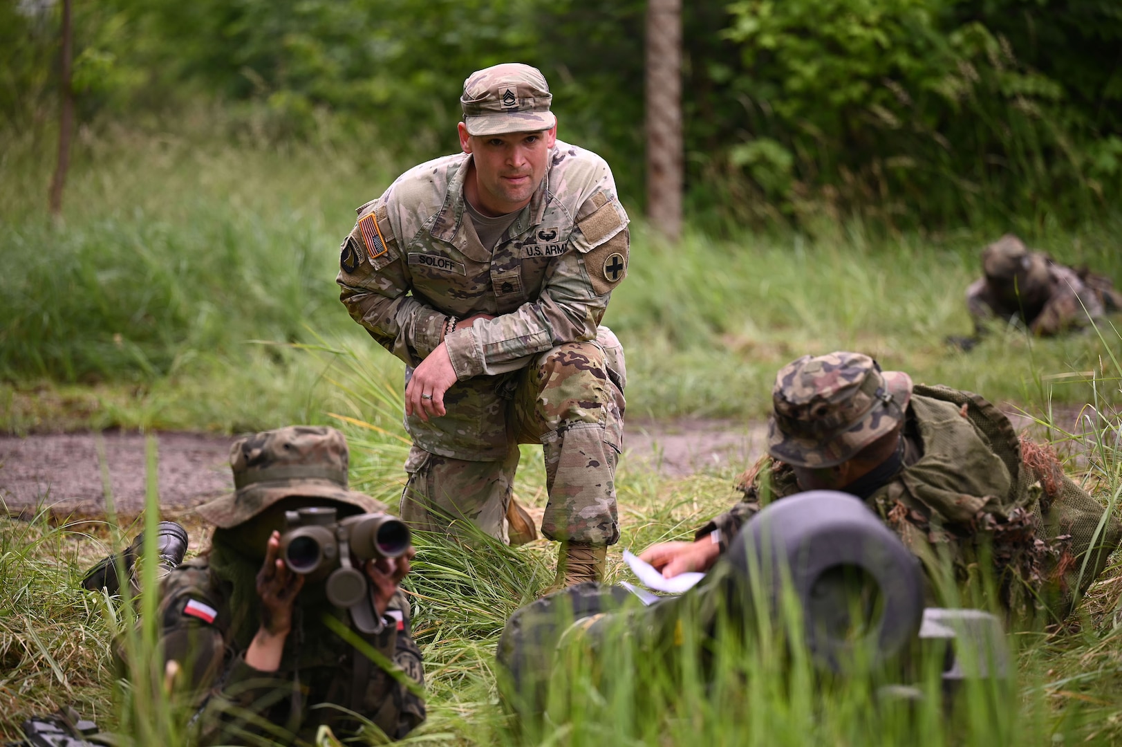 U.S. Army Sgt. 1st Class Benjamin Soloff, an infantryman with Charlie Company, 1st Brigade, 178th Infantry Regiment, Illinois Army National Guard, observes Polish Territorial Defence soldiers as they prepare range cards necessary for Javelin deployment during Javelin anti-armor ambush training at the TDF Training Center in Toruń, Poland, June 11, 2025.