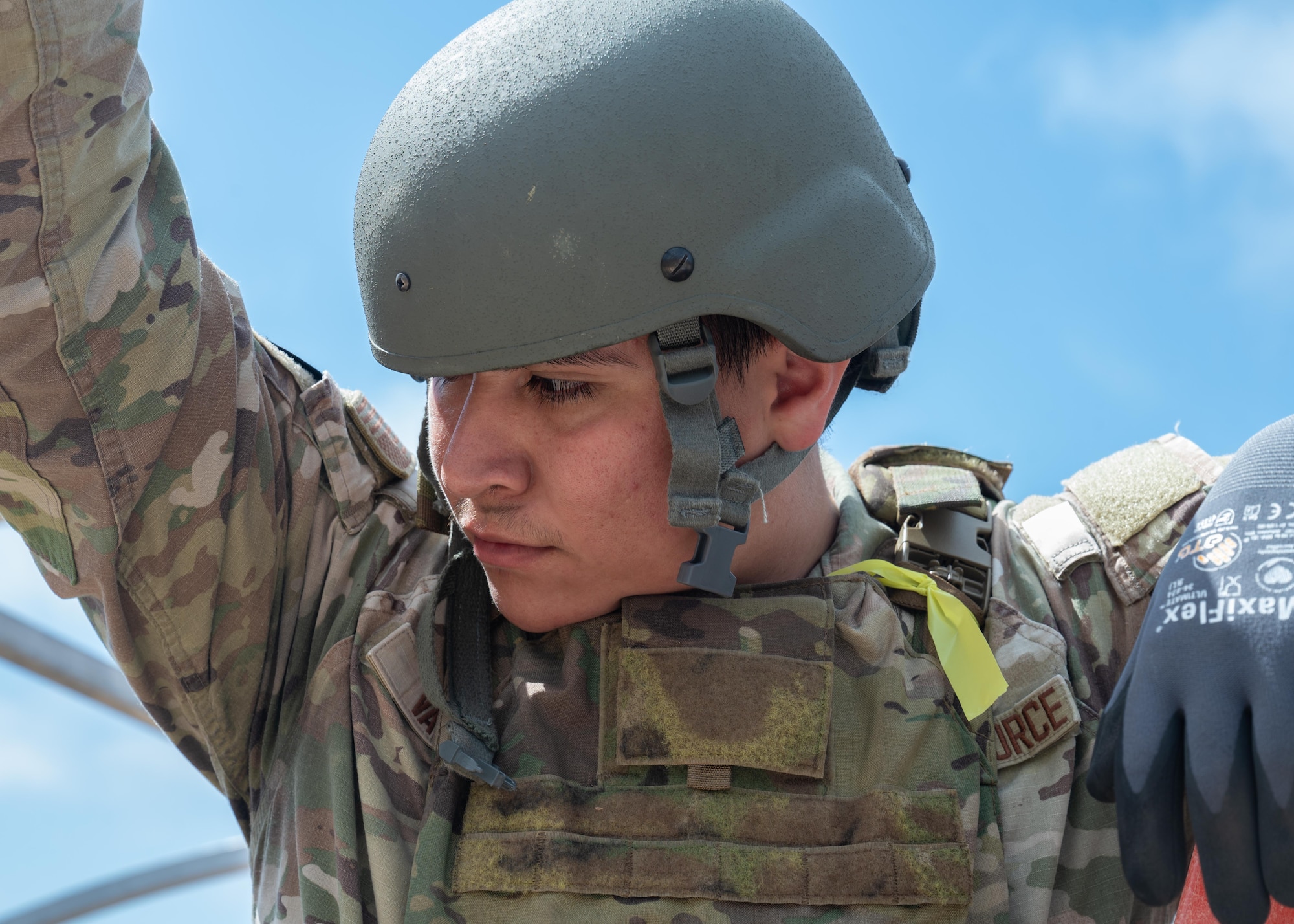 U.S. Air Force Senior Airman Victor Varela, 30th Civil Engineer Squadron electrician, prepares to lift the door of a TEMPER tent, or Tent Extendable Modular Personnel, up during 30 CES’s Prime Base Engineer Emergency Force Day at Vandenberg Space Force Base, Calif., June 26, 2025. Members of 30 CES trained on a variety of core competencies to include rapid airfield damage repair, base buildup, and tactical combat casualty care.